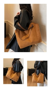 Detailed view of brown suede tote bag with leather straps for a chic minimalist look