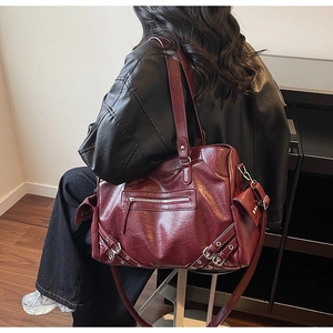 Deep red vintage oil-wax leather tote bag with metallic zipper and rivet details