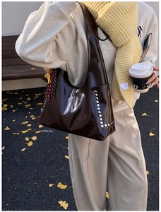 Large dark brown leather hobo bag with silver rivets and vintage style for daily use