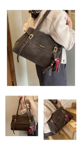 Detail of dark brown tote bag with bear charm showing shoulder carry and hand-held styles