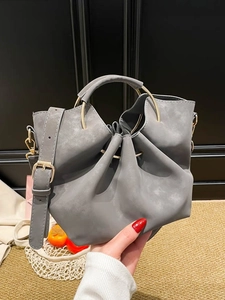 Vintage grey matte pleated underarm bag with gold metal ring handles and shoulder strap