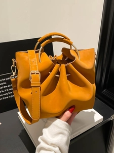Vintage yellow bucket bag with gold ring handle and adjustable strap for women