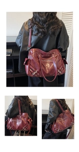 Detail view of burgundy leather tote bag with vintage metal zippers and rivets