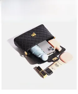 Internal view of quilted crossbody bag showing spacious compartments and daily essentials