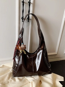 Brown high-gloss patent leather tote bag with silver studs and cute bear pendant