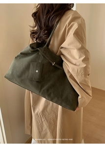 Detail of dark green suede tote bag with matching coin purse and retro minimalist vibe