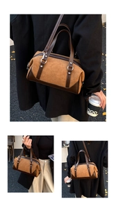 Detail of vintage brown suede patchwork handbag with adjustable strap and silver hardware