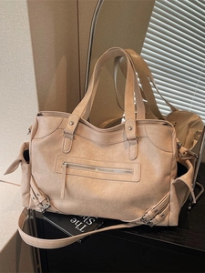 Retro oversized beige tote bag with pleated texture and stylish motorcycle-style pockets