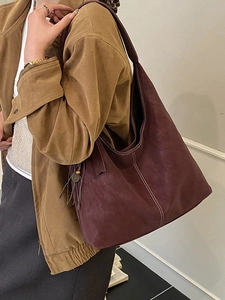 Retro burgundy large tote bag with contrast stitching and tassels on shoulder