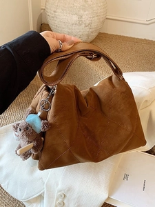 Brown quilted diamond pattern large shoulder bag with cute bear charm for daily commute