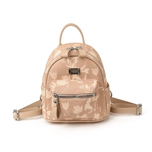 Minimalist beige floral mini backpack with adjustable leather straps and metal logo