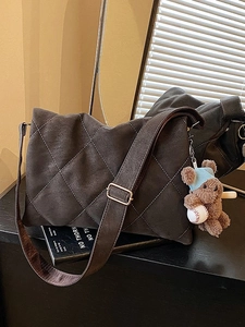 Large dark coffee rhombus quilted shoulder bag in matte finish with a plush bear charm