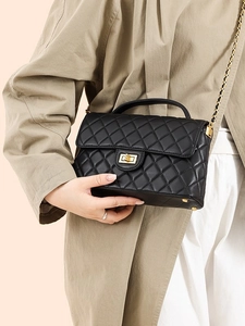 Classic black quilted leather crossbody bag with gold twist lock and chain strap