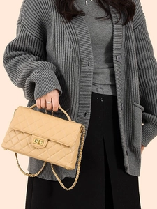 Fashionable beige quilted crossbody bag with gold chain strap and metal turn-lock