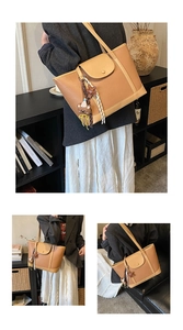 Brown lychee texture tote bag detail with plush bear charm and magnetic flap pocket