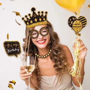 Black and gold birthday photo booth props set featuring crown and glittery party designs