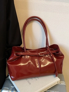 Vintage burgundy oil wax leather tote bag with high-gloss finish and metal buckle detail
