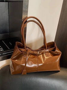 Vintage brown glossy oil wax leather tote bag with dual straps and buckle detail
