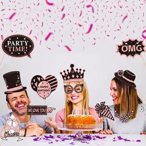 Three people using rose gold birthday party photo props including crowns and party glasses