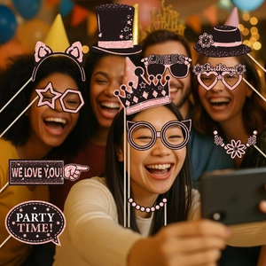 Group of friends using black and rose gold glitter photo props at a festive birthday party