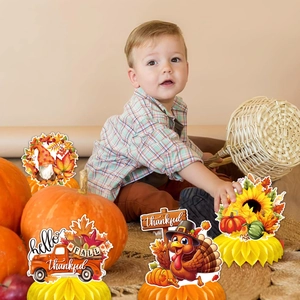 Detail of Thanksgiving honeycomb centerpieces with maple leaves and turkey patterns