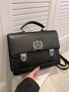 Classic black British style crossbody messenger bag with silver shield embroidery and dual buckles