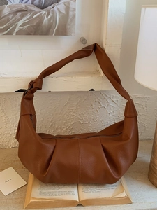 Brown vintage slouchy croissant bag in soft leather with pleated texture and knotted strap
