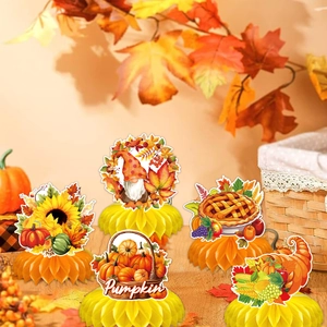 Close-up of five Thanksgiving honeycomb centerpieces with pumpkin and gnome designs