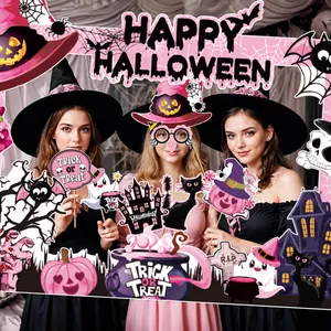 Close-up of pink Halloween photo booth props set with cute pumpkin and ghost cutout designs