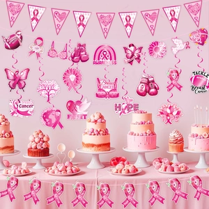 Pink ribbon breast cancer awareness party decorations with banners and hanging swirls
