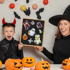 Children in Halloween costumes with spooky stickers and carved pumpkins on display