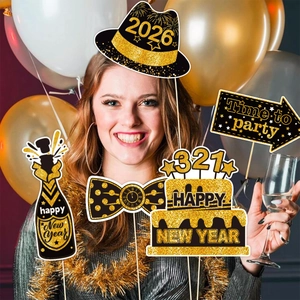 Detail of 2026 New Year photo booth props with glitter hats and party decorations