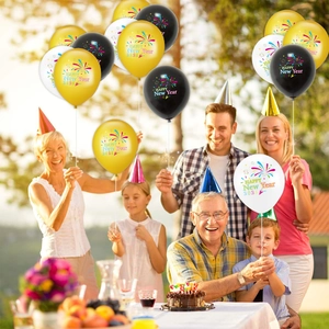 Family celebrating with 2026 Happy New Year balloons featuring colorful fireworks design