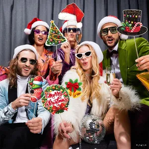 Christmas party photo booth props with festive hats and trees for holiday photography