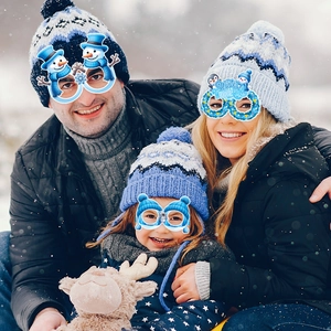Winter Wonderland party glasses set worn by a family for Christmas photo props outdoors