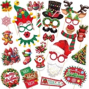 Christmas party photo booth props kit with Santa hats, reindeer antlers and glitter glasses