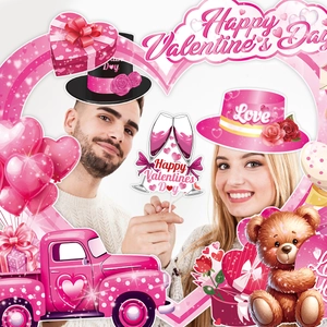 Valentine's Day photo booth props set with heart frames and romantic party decorations