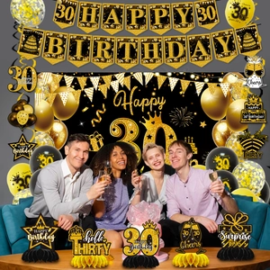 30th birthday party set with black and gold banners balloons and honeycomb centerpieces