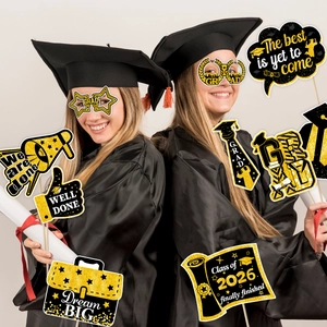 Class of 2026 graduation party photo booth props with black and gold glitter texture