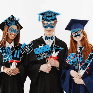 Class of 2026 graduation photo props with blue glitter crowns and themed eyewear