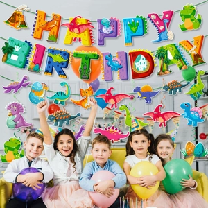 Kids birthday scene featuring colorful dinosaur theme banner and spiral hanging decorations