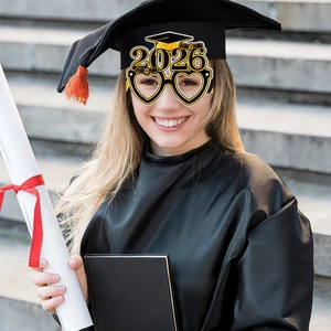 Close-up of 2026 graduation party glasses with mortarboard on a student in robe