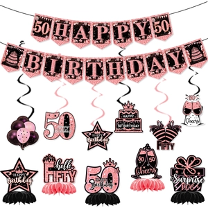 Macro view of 50th birthday party decorations in rose gold and pink glitter finish