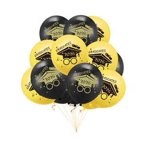 Close-up of Class of 2026 graduation balloons in black and yellow with festive prints