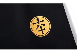Close-up of yellow Chinese chess graphic and smooth fabric texture on black sports shorts
