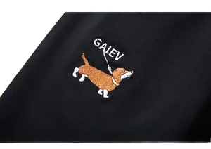 Macro detail of high-quality embroidery featuring a dachshund dog and GAIEV text