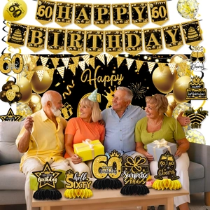 Detailed set of black and gold 60th birthday party decorations with banners and balloons