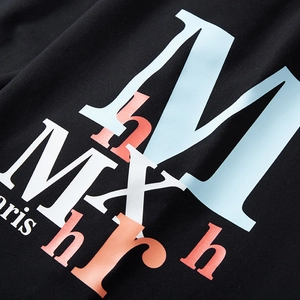 Men's loose fit sports shorts in black cotton featuring artistic colorful letter print
