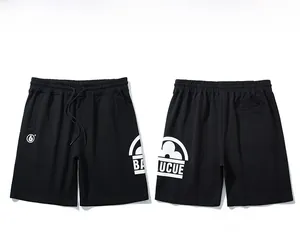 Front and back view of black drawstring athletic shorts with white logo printing