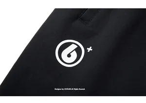 Detailed macro shot of high-quality black knit fabric with white circular logo print